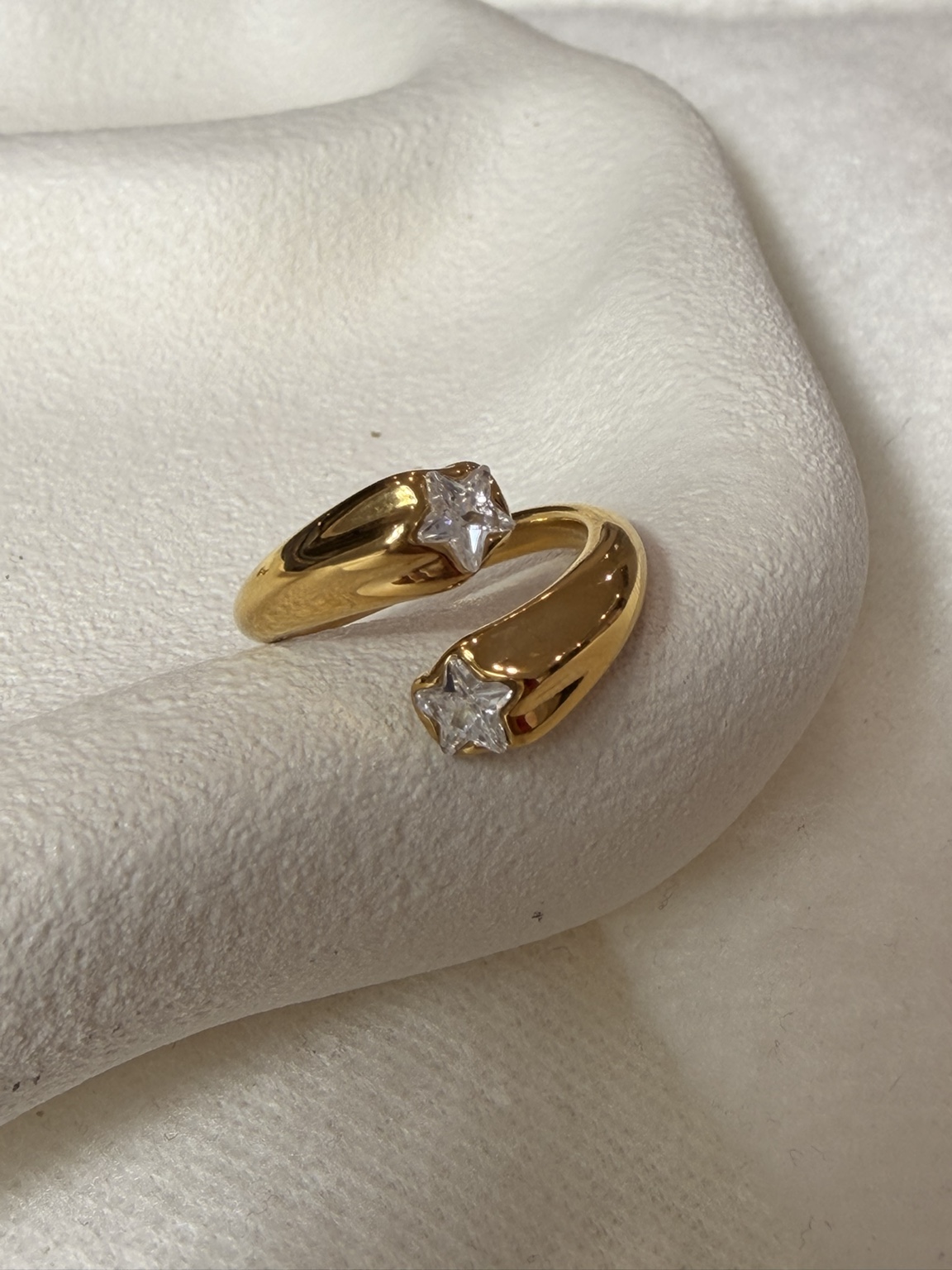 Twin Star Ring with two clear star-shaped stones, front view
